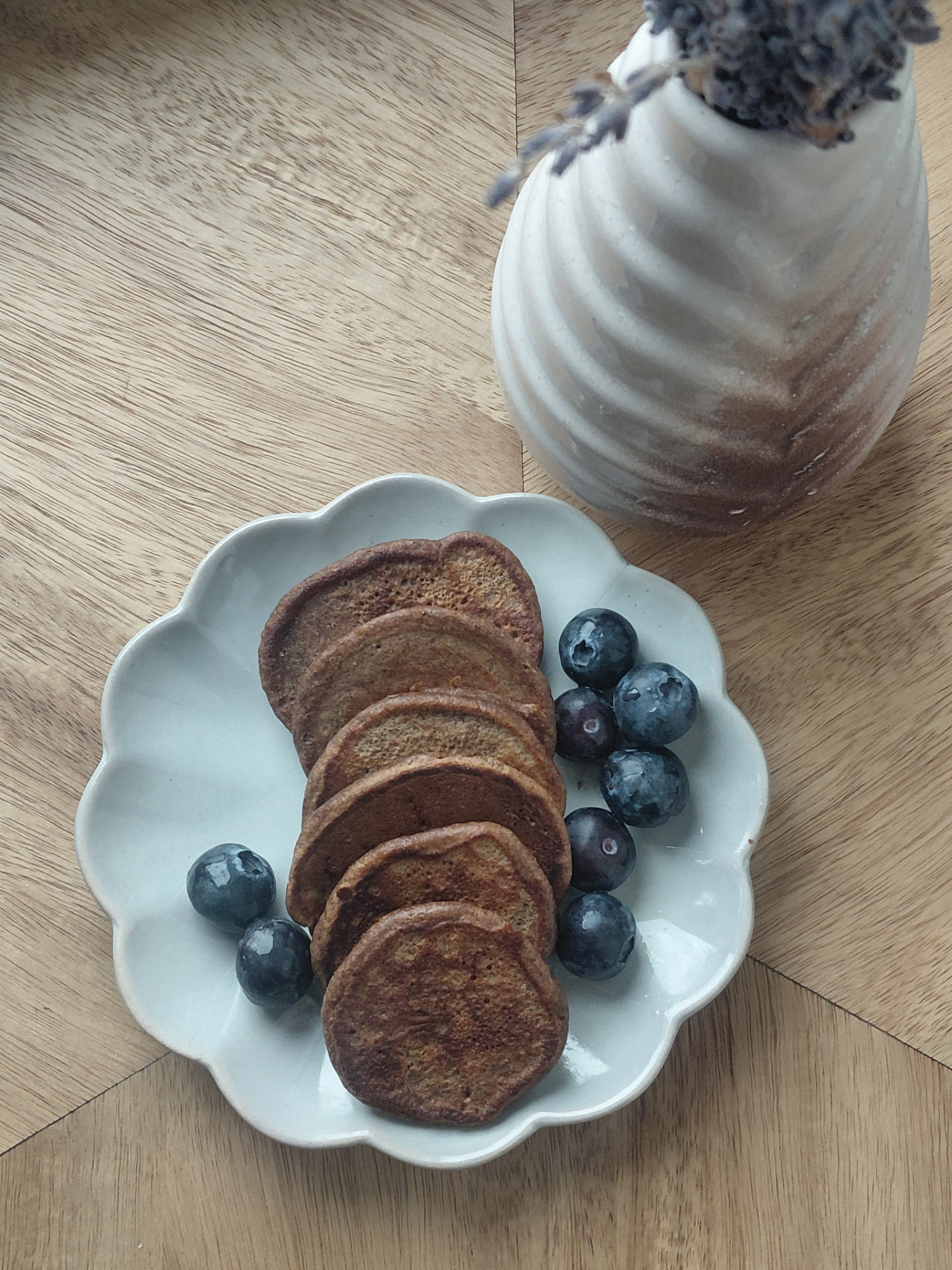 Pancakes made with upcycled spent grain flour, served with blueberries